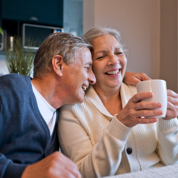 Happy, mature couple in kitchen