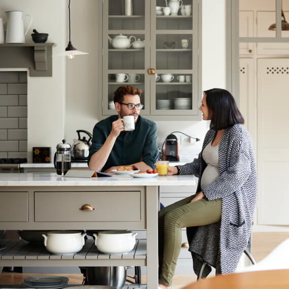 couple sitting in kitchen