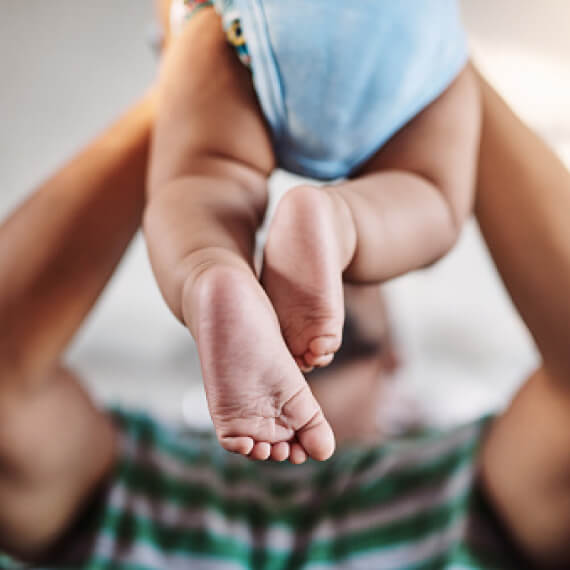 Man holding young baby